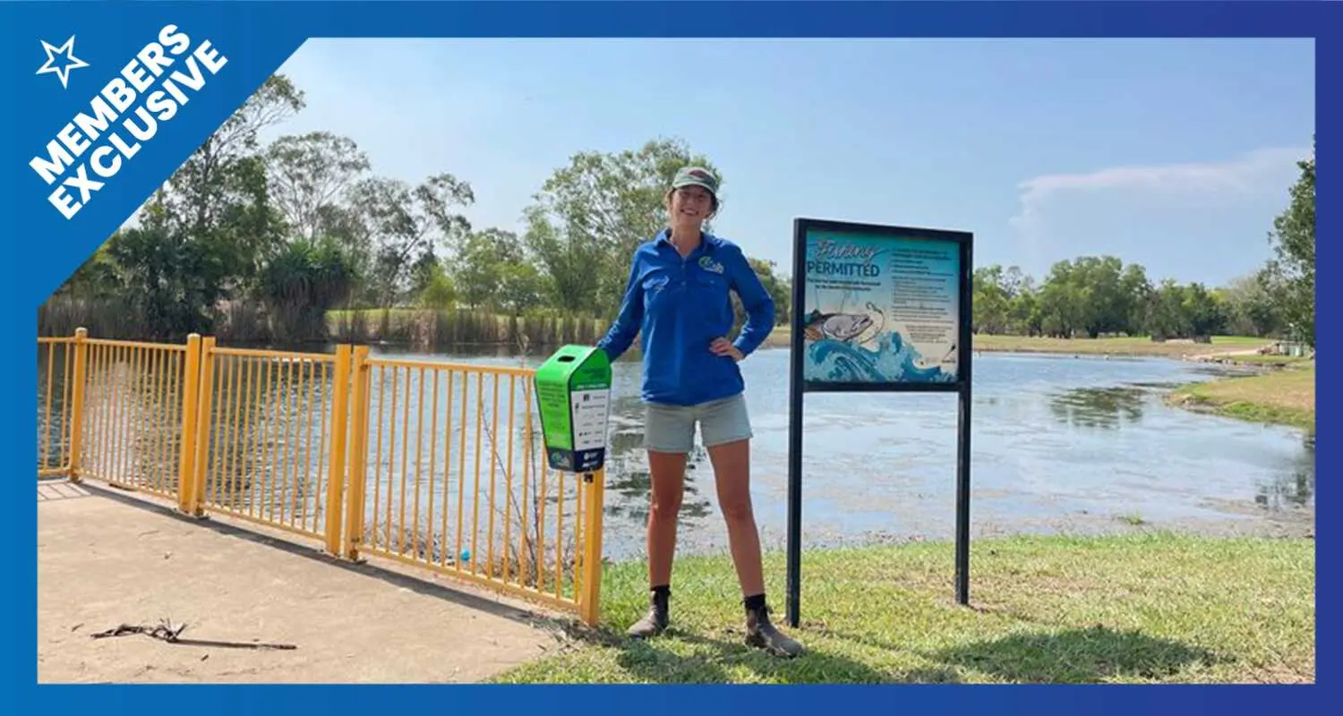 A women standing in a blue shirt by a jetty with a tangle bin attached. The image has a blue border that says Members Exclusive in the corner.