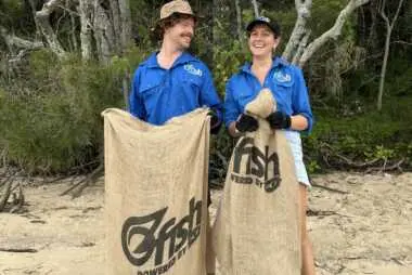 OzFish volunteers with bags full of rubbish
