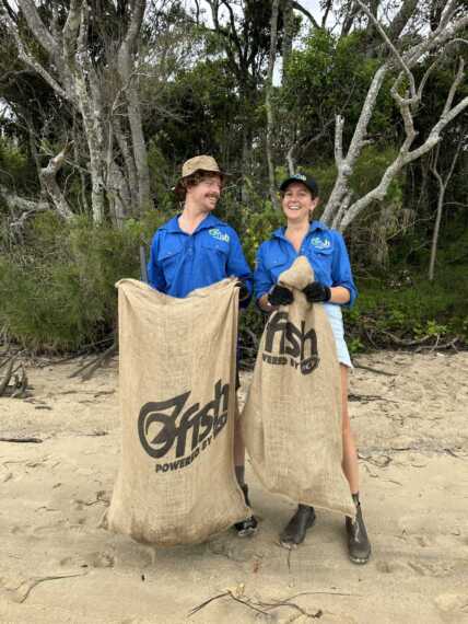 OzFish volunteers with bags full of rubbish