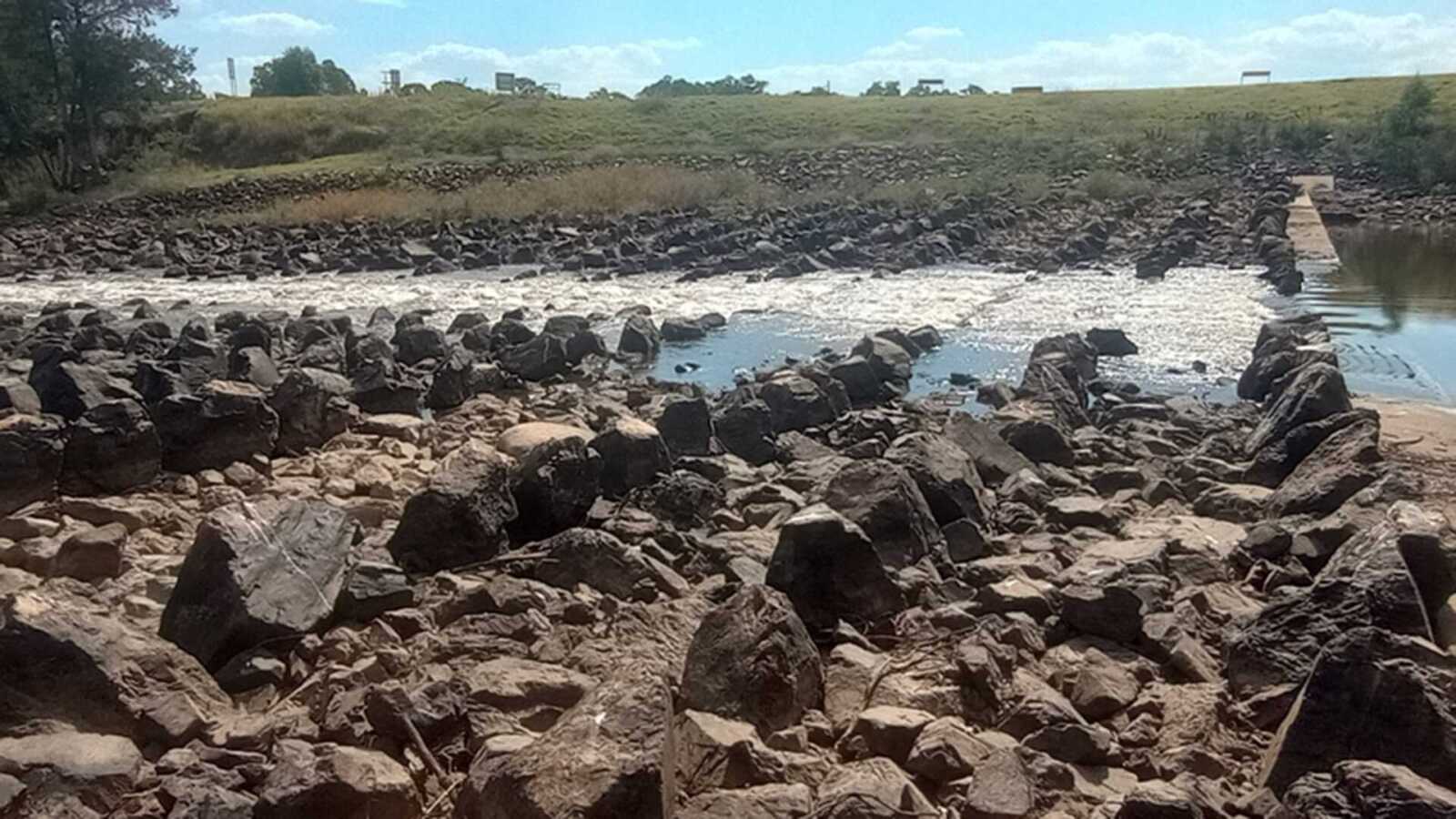 rocks lined up with water in the middle